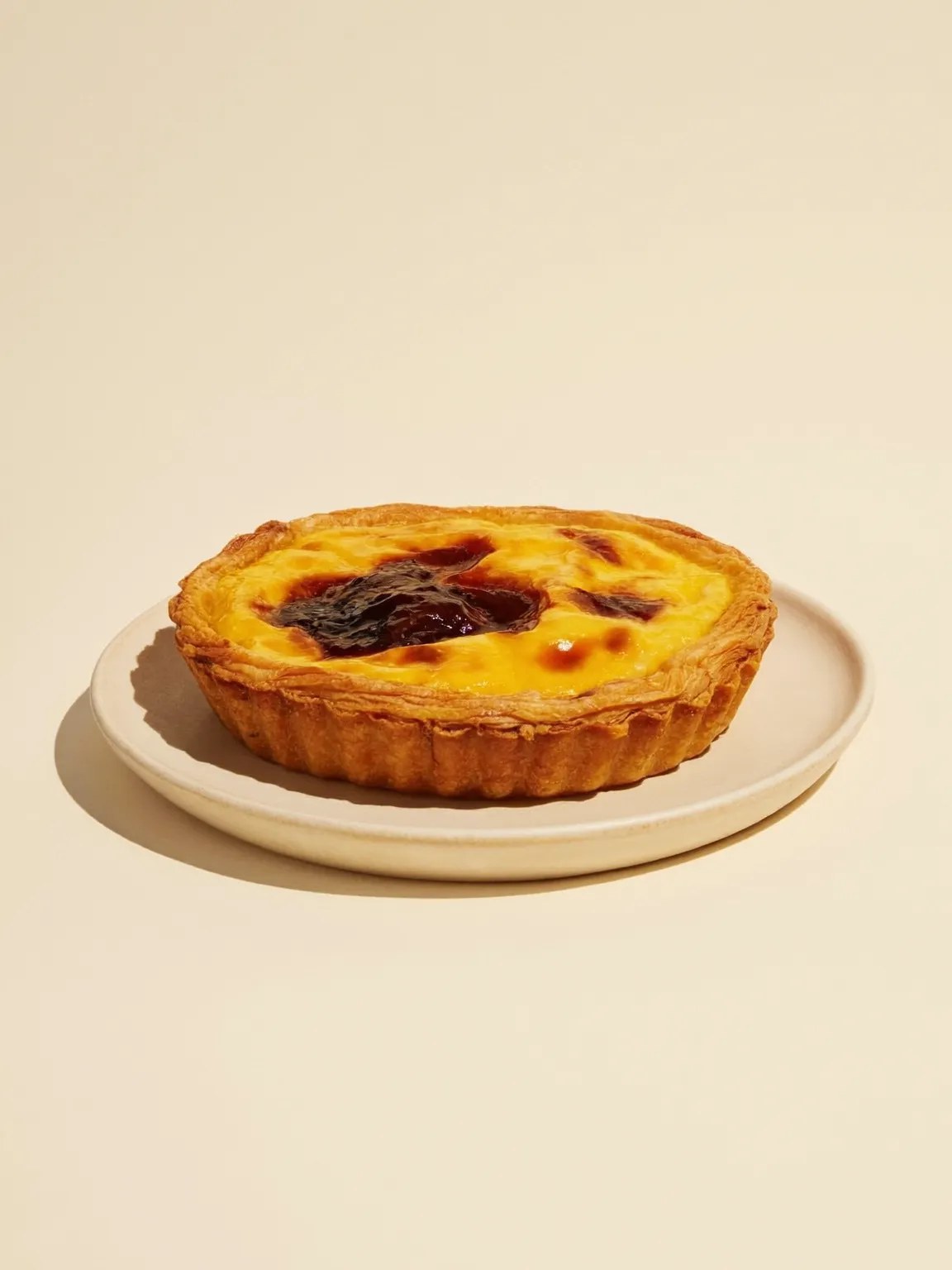 A Portuguese custard tart with a caramelised top